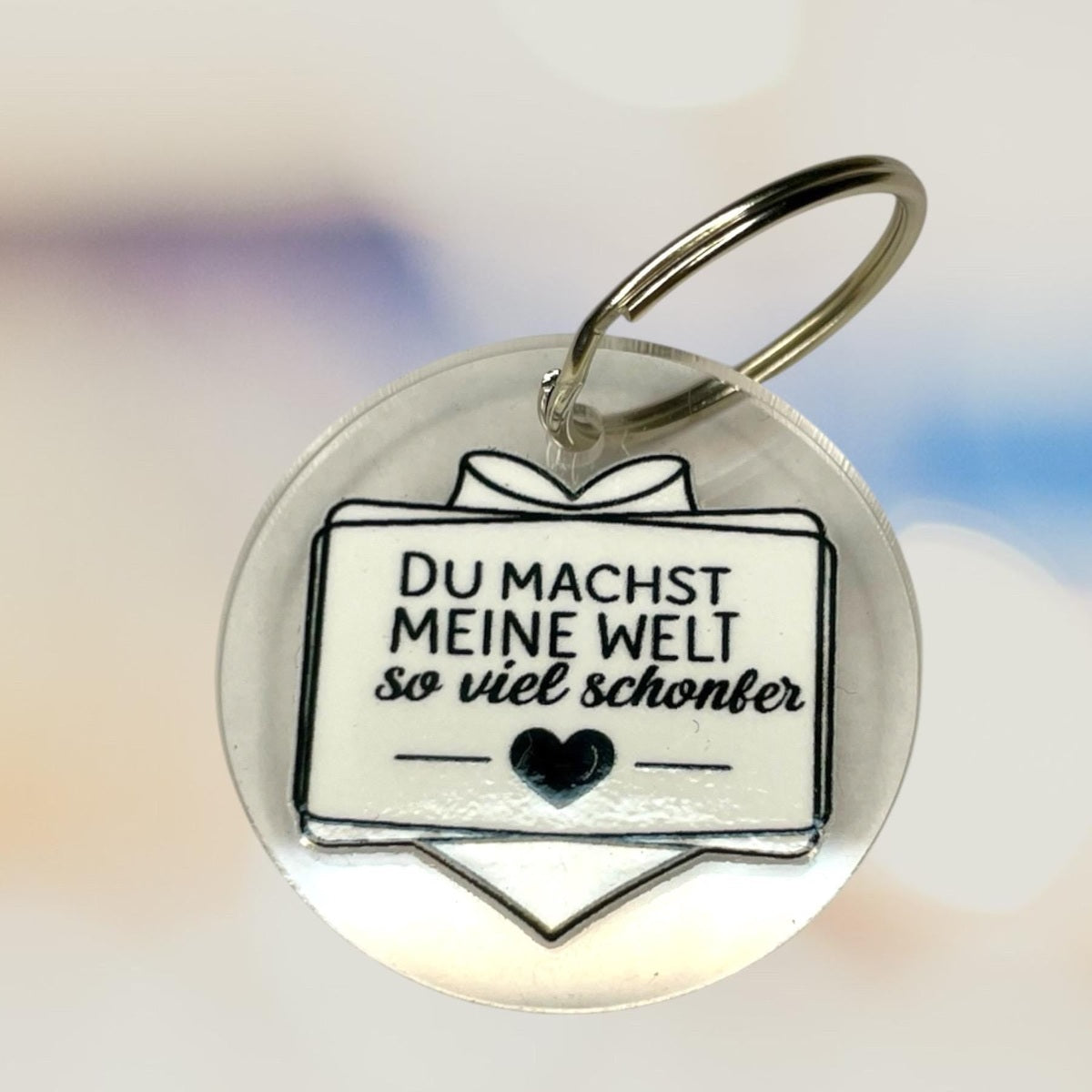 Schlüsselanhänger "Du machst meine Welt so viel schöner" – Liebevolles Geschenk aus klarem Acryl Schlüsselanhänger Das Glückswerk